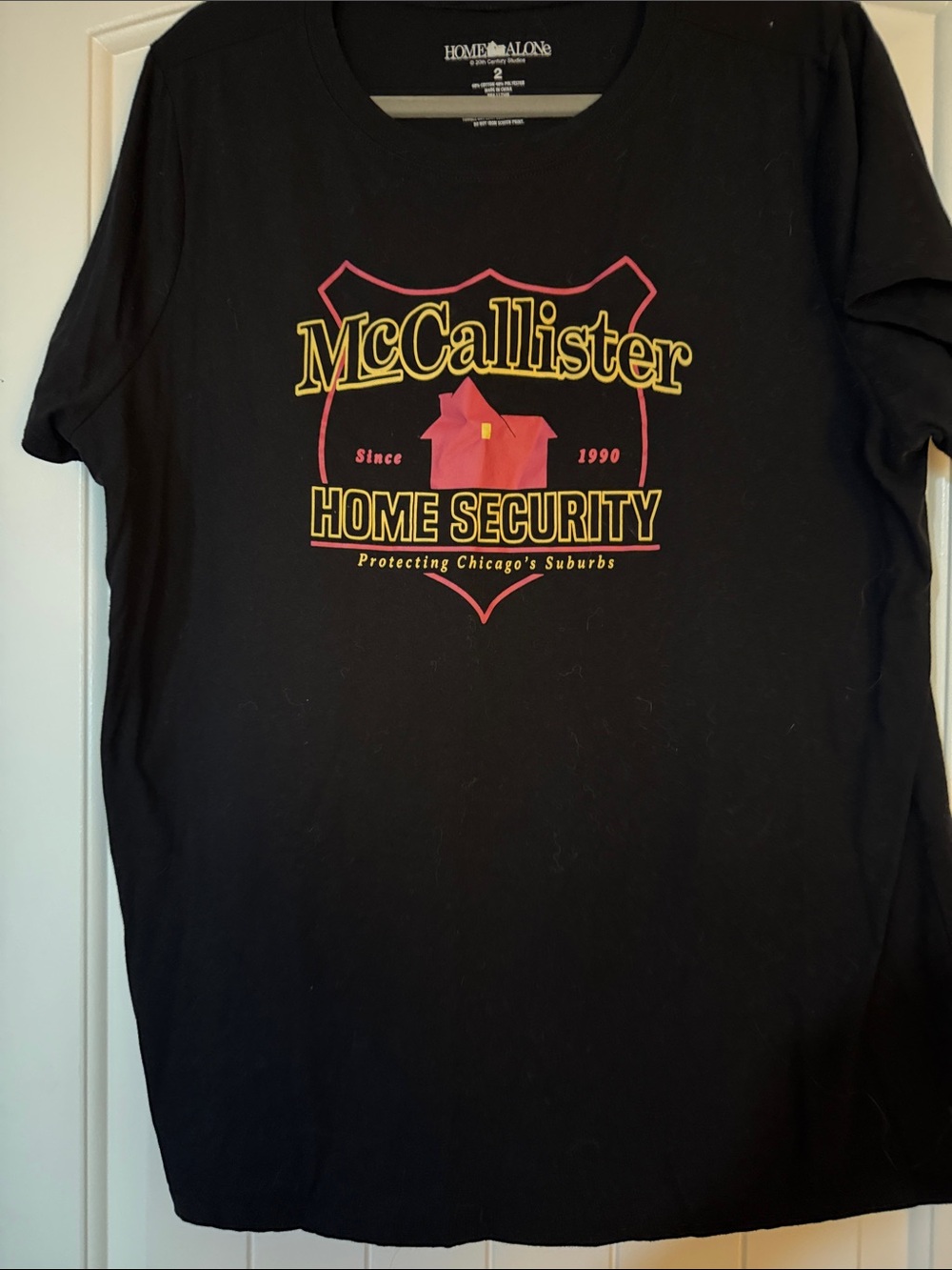 torrid Black McCallister Home Security Graphic Tee with Yellow & Pink Print